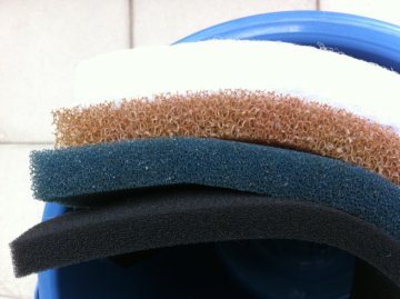 The lowest black filter media has the finest holes, followed by the blue one and the orange one with the largest holes. The white on top is changed often. The lowest black filter media has the finest holes, followed by the blue one and the orange one with the largest holes. The white on top is changed often.