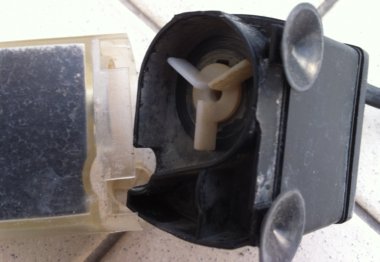 A close up of the fan and notice the 2 suction cups to hold the filter in place A close up of the fan and notice the 2 suction cups to hold the filter in place